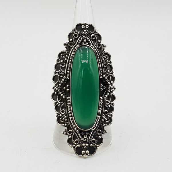 A silver ring set with an oval green Onyx in any setting