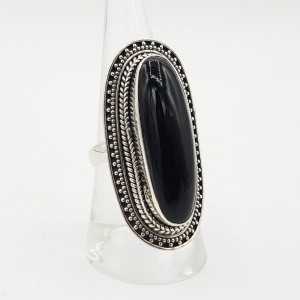 A silver ring set with an oval black Onyx.