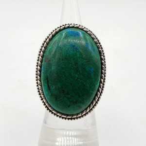 A silver ring set with a large oval-shaped Chrysocolla 16.5 mm