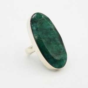 A silver ring set with a large oval-shaped Emerald is 17.5 mm