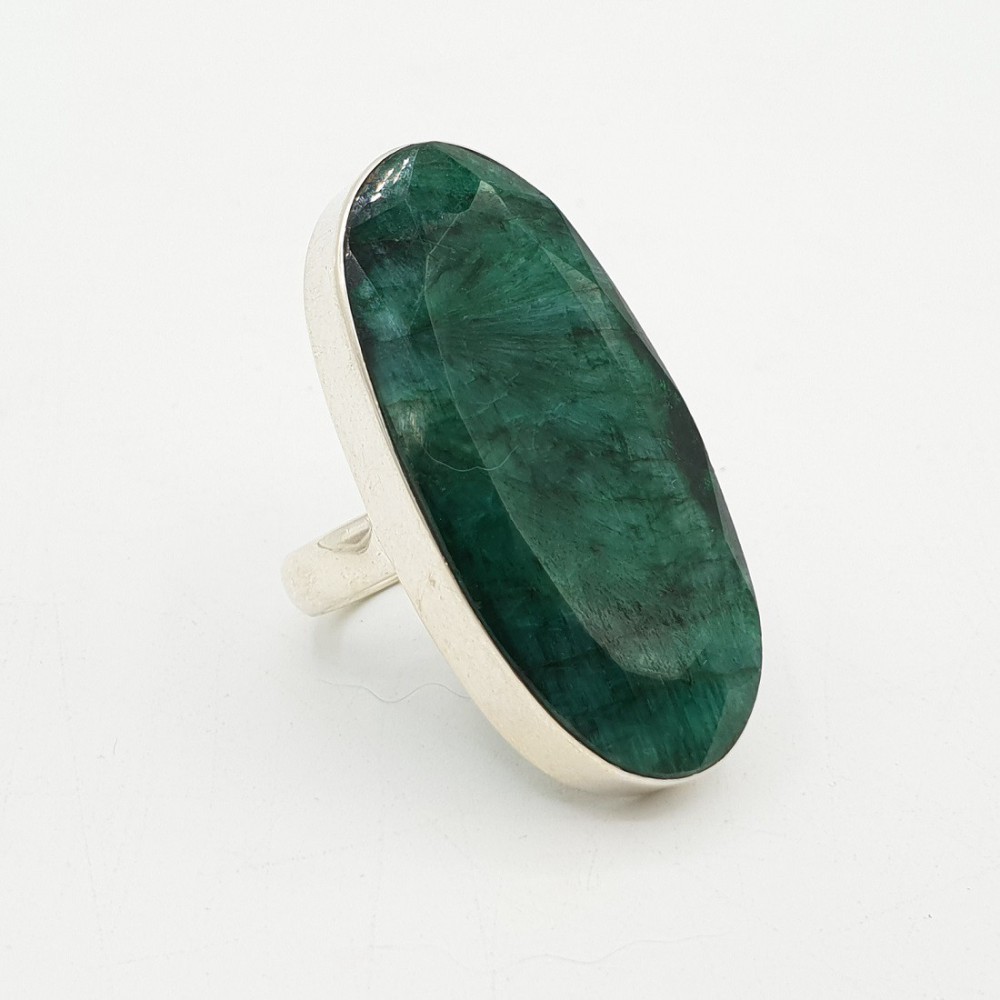 A silver ring set with a large oval-shaped Emerald is 17.5 mm