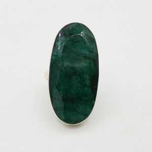 A silver ring set with a large oval-shaped Emerald is 17.5 mm