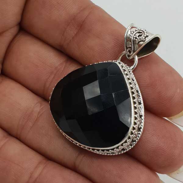 Silver pendant, faceted Onyx set in a carved setting