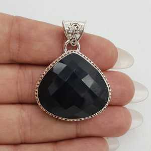 Silver pendant, faceted Onyx set in a carved setting