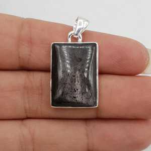 A silver pendant set with a rectangular-Hypersteen