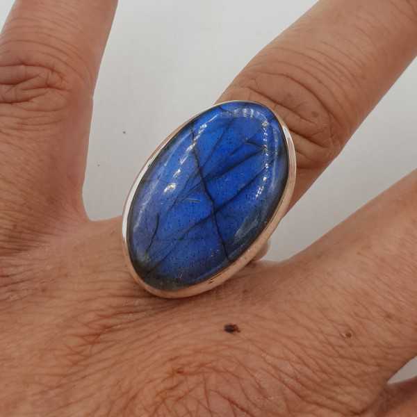 A silver ring set with an oval cabochon Labradorite is 17 mm