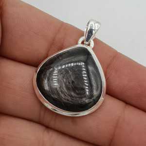 A silver pendant set with large oval Hypersteen