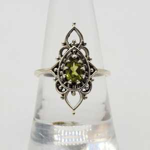 A silver ring set with Peridot 17.5 mm