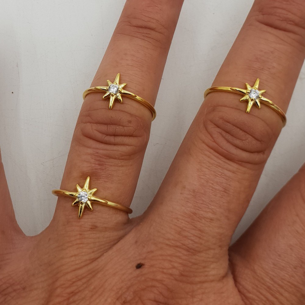 Vergoldeter ring mit der north star, set mit Zirkonia