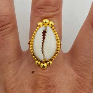 Gold-plated ring is set with a Cowrie shell