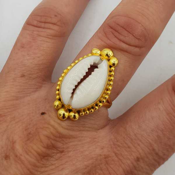 Gold-plated ring is set with a Cowrie shell