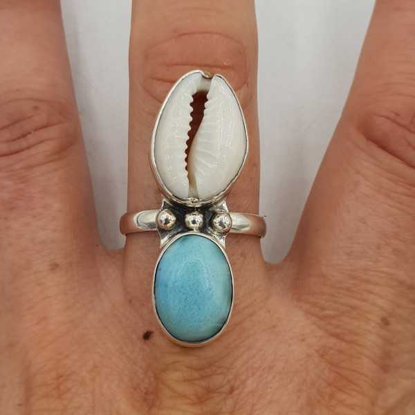 A silver ring set with a Cowrie shell and Larimar 19.5 mm