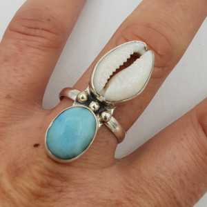A silver ring set with a Cowrie shell and Larimar 19.5 mm