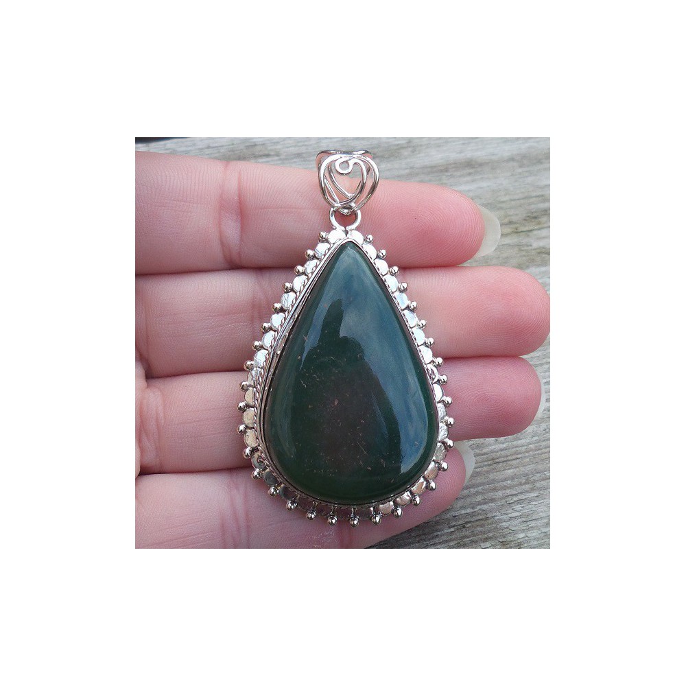 Silver pendant drop shape Nephriet Jade set in a carved setting 