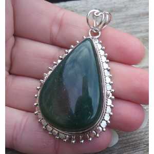 Silver pendant drop shape Nephriet Jade set in a carved setting 