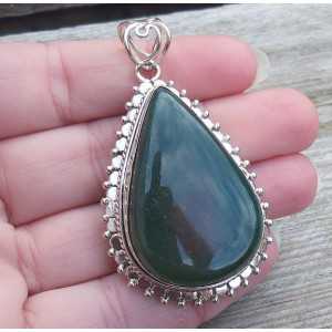 Silver pendant drop shape Nephriet Jade set in a carved setting 