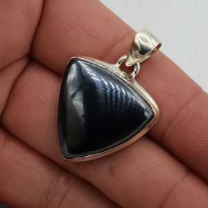 A silver pendant with a triangle-shaped Hematite
