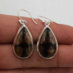 Silver drop earrings set with teardrop-shaped crystal Chiastoliet