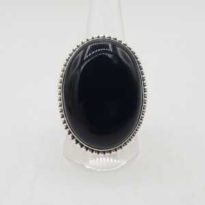 Zilveren ring gezet met grote brede ovale zwarte Onyx 20 of 19.5 mm