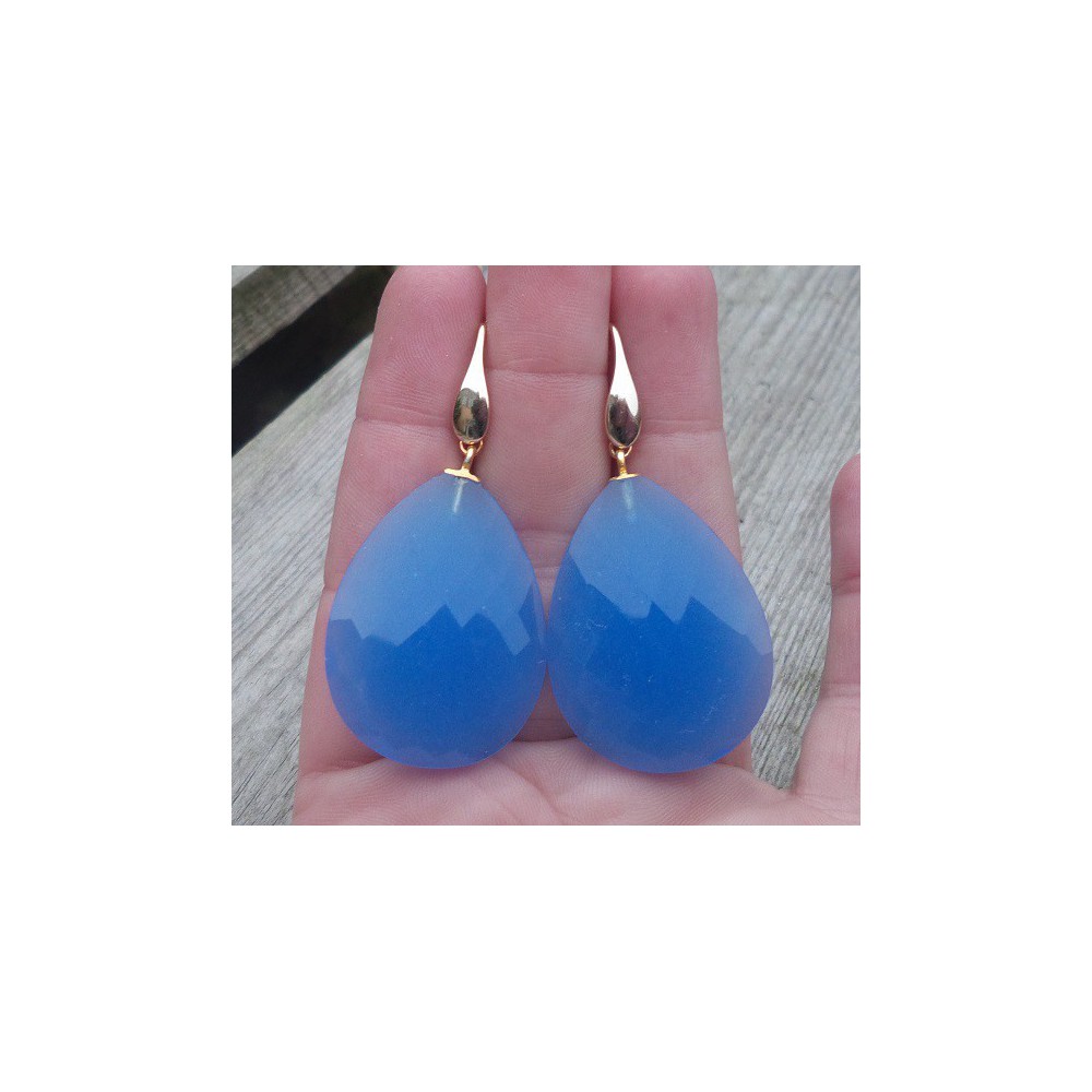 Gold plated earrings set with large faceted blue Chalcedony 