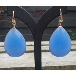 Gold plated earrings set with large faceted blue Chalcedony 