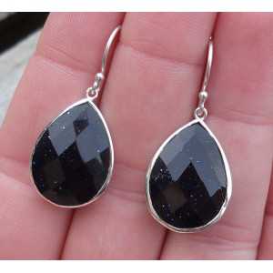 Silver earrings set with oval shape facet Goudsteen