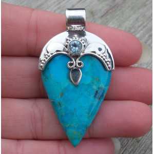 Silver pendant set with Turquoise and blue Topaz