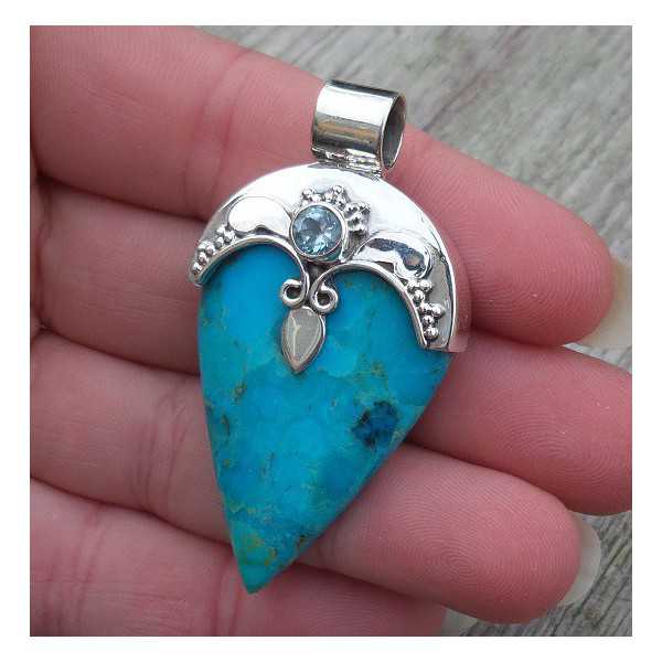 Silver pendant set with Turquoise and blue Topaz