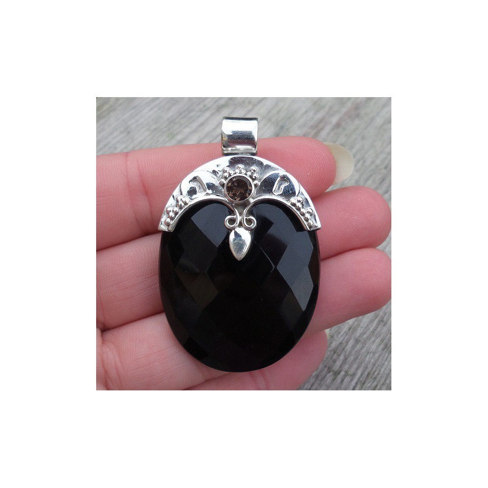 Silver pendant set with oval faceted Onyx and round Smokey Topaz 