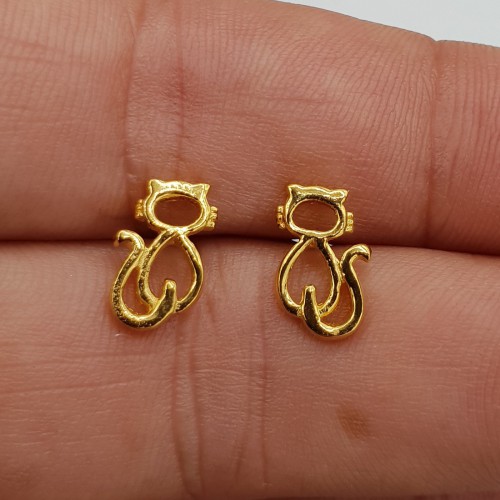 Vergulde oorknoppen poes