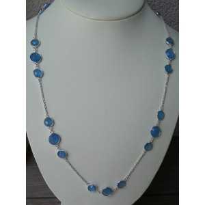 Silver necklace set with round faceted blue Chalcedony