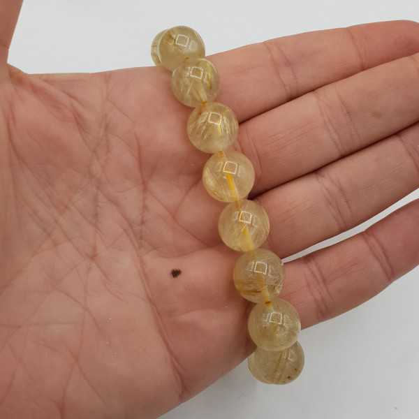 Stretch bracelet with golden Rutielkwarts beads