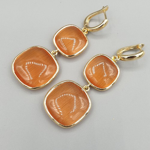 Vergulde oorbellen met oranje Kattenoog