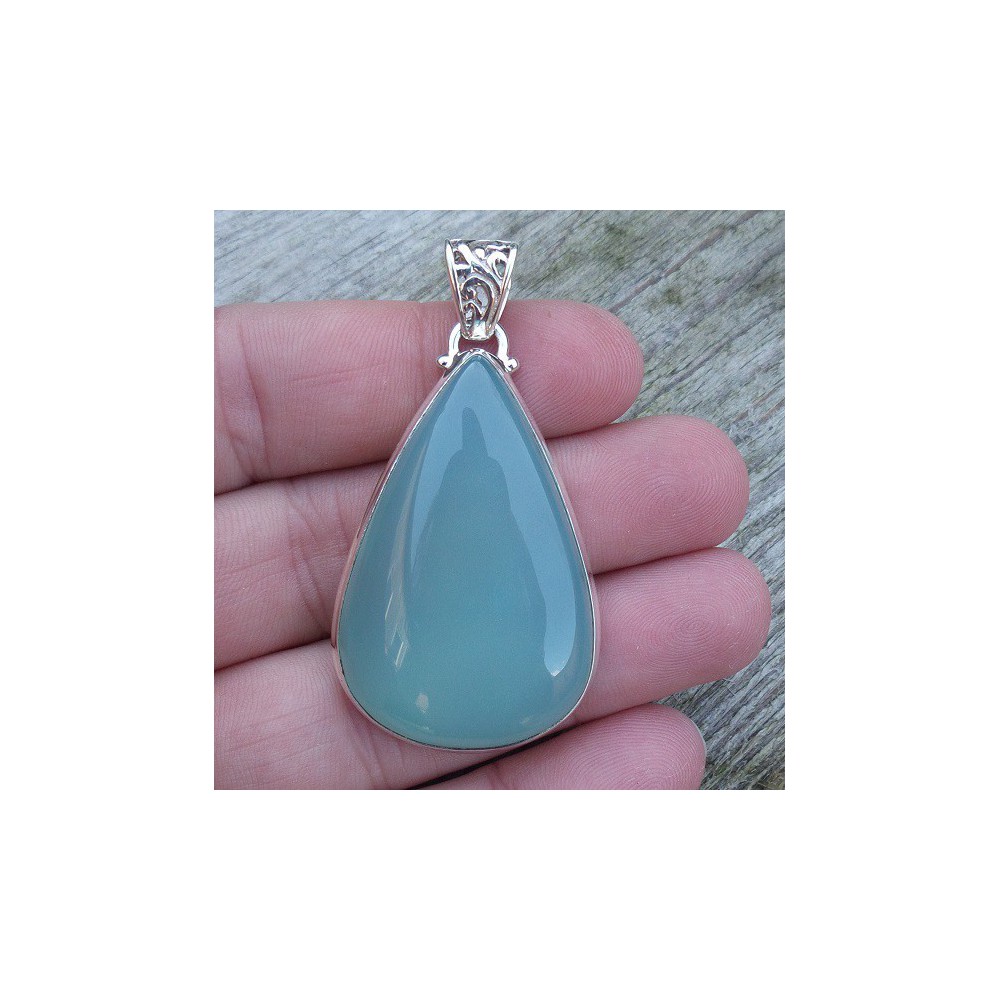 Silver pendant set with oval shape aqua Chalcedony