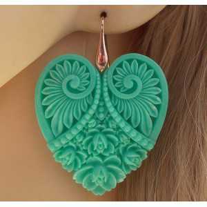 Gold plated earrings with cut out heart mint green