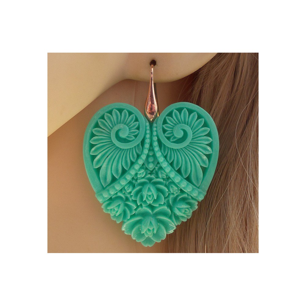 Gold plated earrings with cut out heart mint green