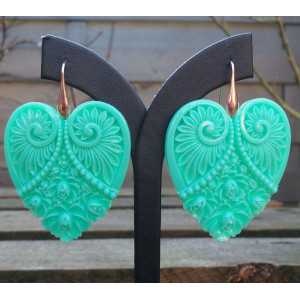 Gold plated earrings with cut out heart mint green