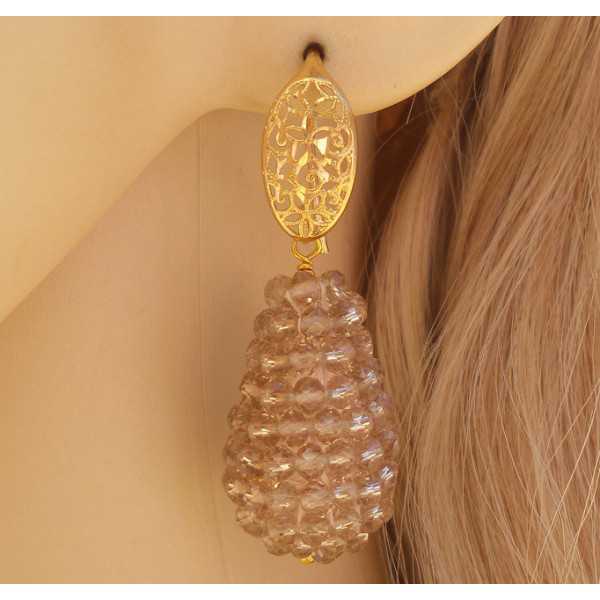 Gold plated earrings with a drop of champagne colored crystals