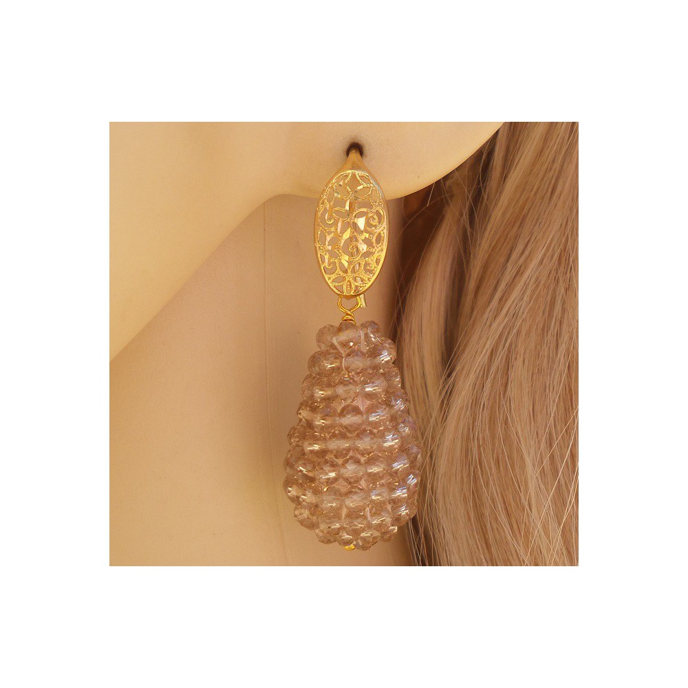 Gold plated earrings with a drop of champagne colored crystals