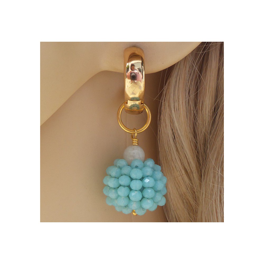 Gold creoles with a globe of blue crystal and Moonstone 