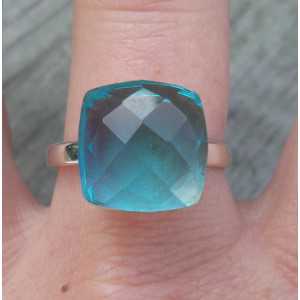 Silver ring set with blue Topaz