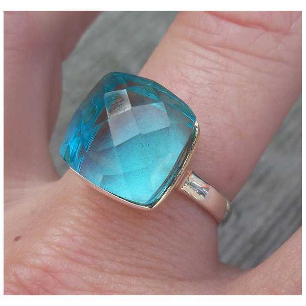 Silver ring set with blue Topaz