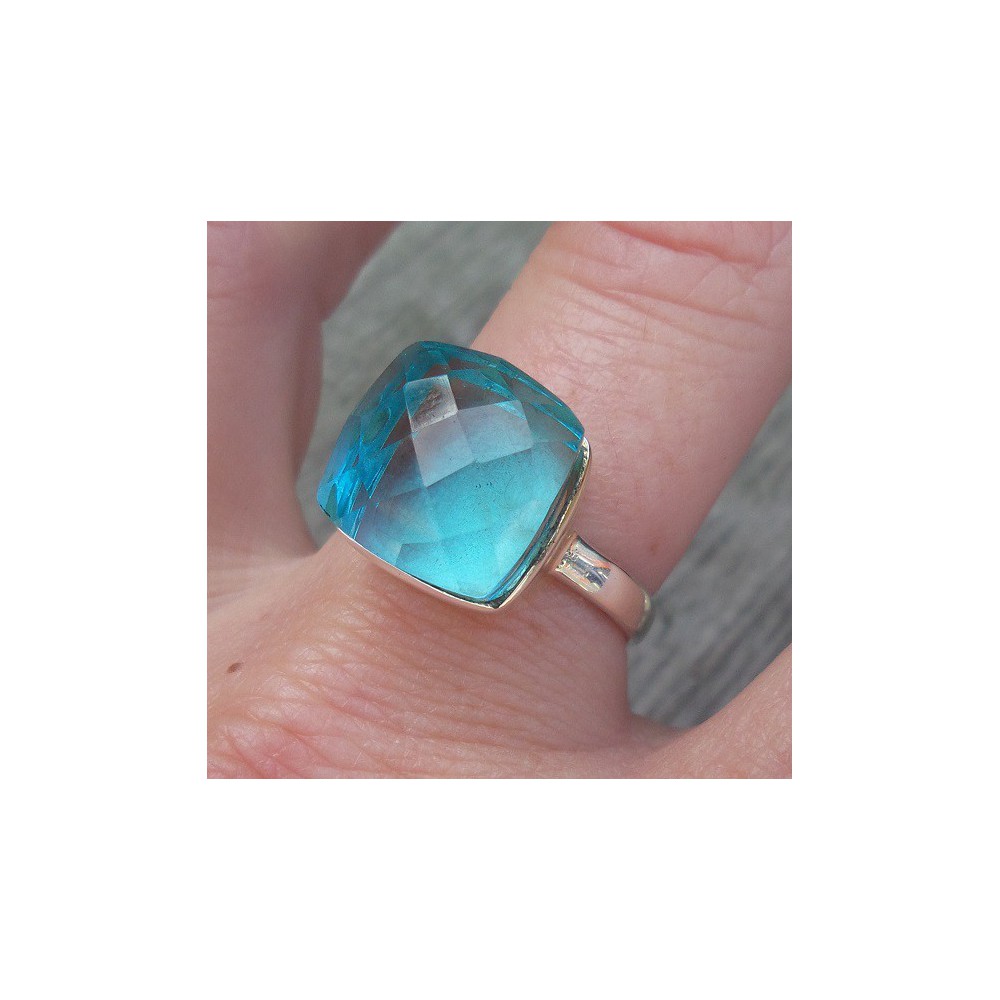 Silver ring set with blue Topaz