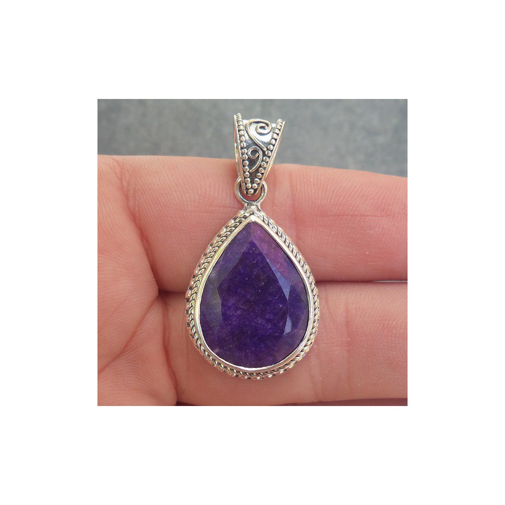 Silver pendant with Sapphire set in a carved setting