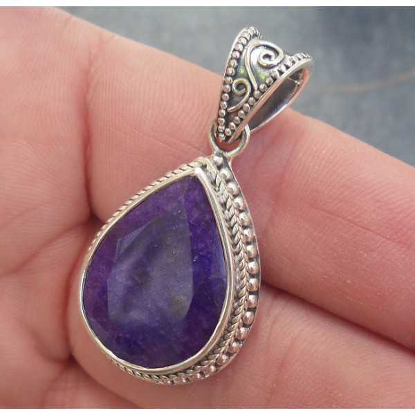 Silver pendant with Sapphire set in a carved setting