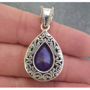 Silver pendant with Sapphire set in a carved setting