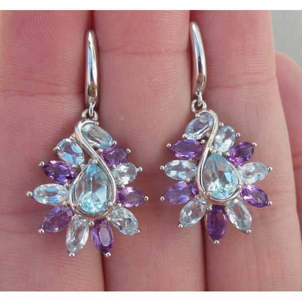 Silver earrings set with faceted blue Topaz and Amethyst