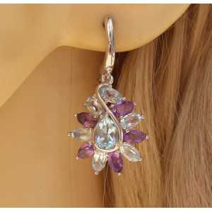 Silver earrings set with faceted blue Topaz and Amethyst