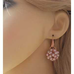 Rosé plated earrings with ball of peach colored Pearls