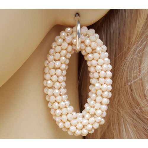 Zilveren creolen met grote ovale van ivoor kleurige Kristallen